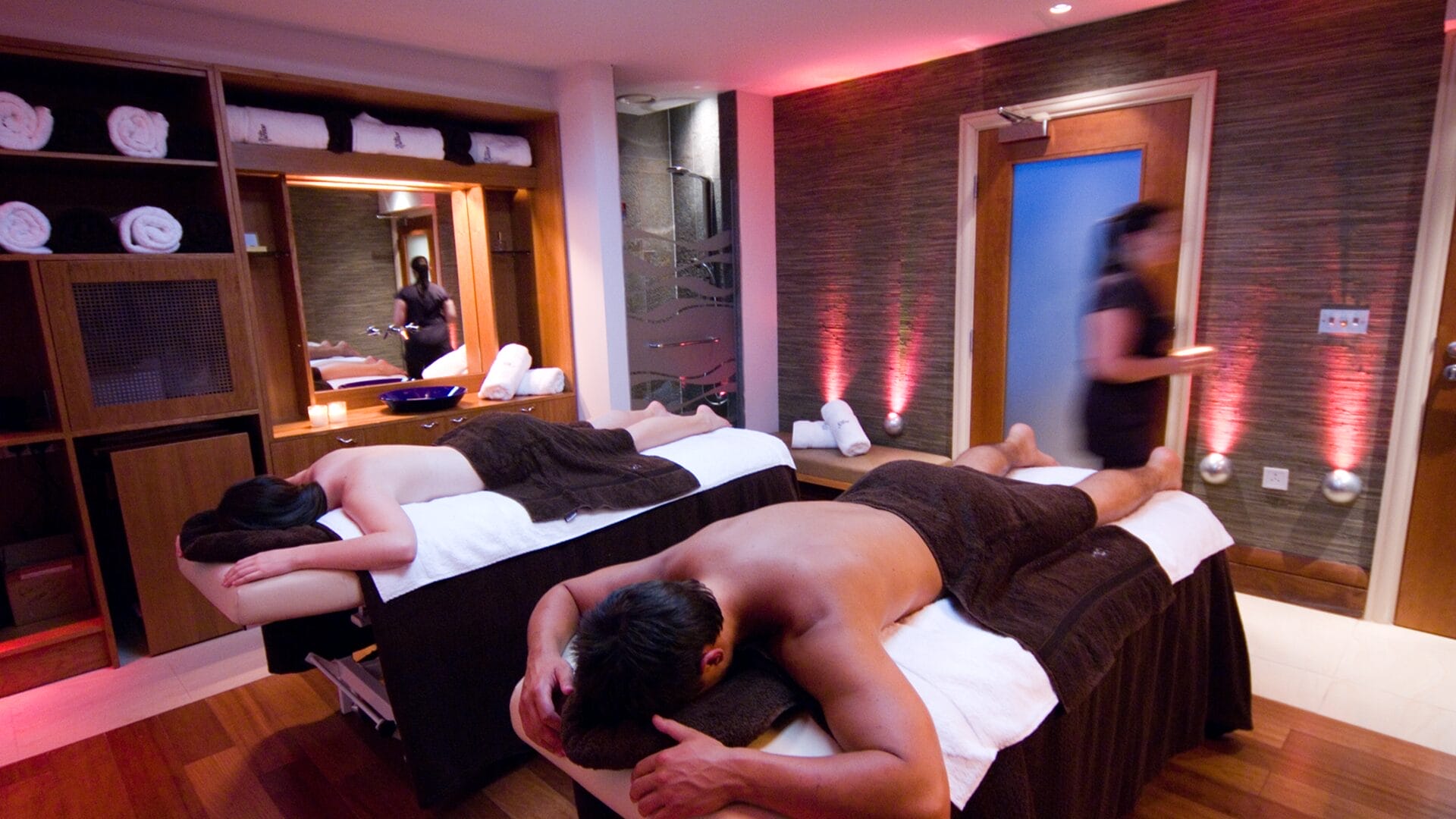 Image 1 Two individuals getting spa treatment