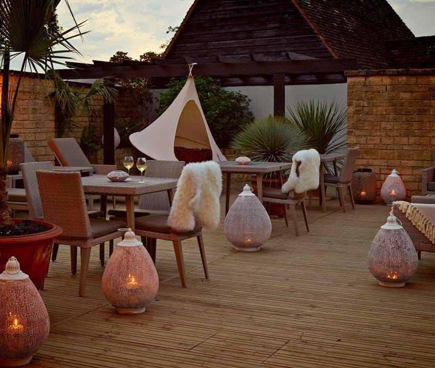 lugon Hotel Spa Roof Terrace outdoor seating area during sunset in a luxurious spa