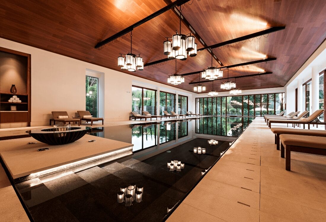 3 Things You Need To Know Before Opening A Luxury Spa A luxurious spa, featuring a calming pool with cosy seating and mood lighting.
